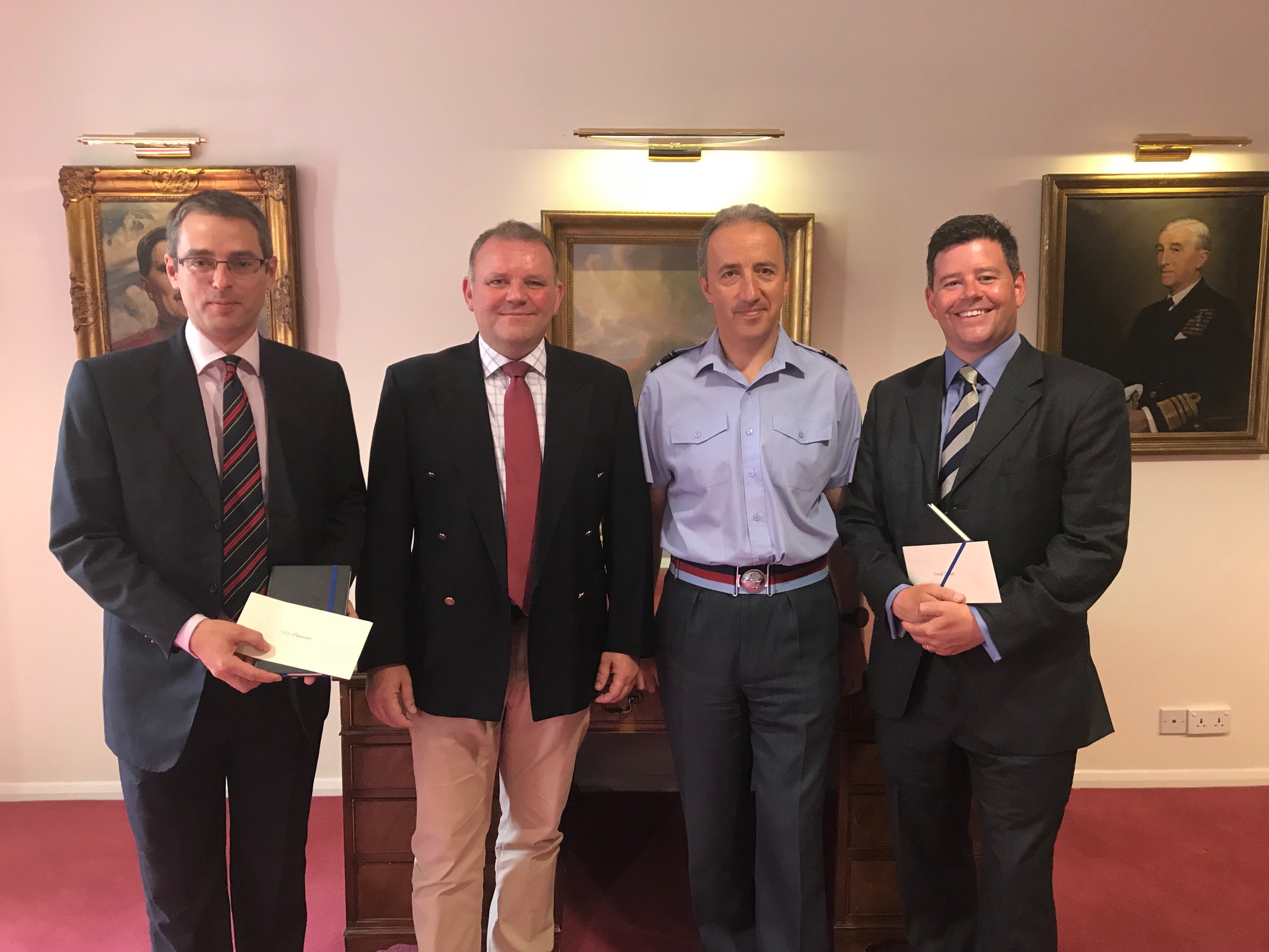 AVM Luck (Comdt JSCSC) and Carl Gorton (Dep Hd Training NSC) awarding prizes to Ant Sharman (best overall essay) and Andy Bell (most innovative) on 19 Jul 18.