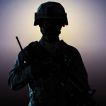 a soldier holds a gun