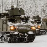 Image: Arctic training for the british army. BV209 vehicles in the snow.